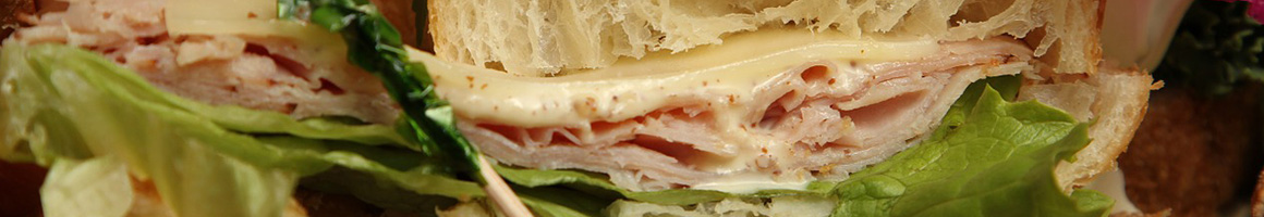 Eating Deli Sandwich at CaféDIA restaurant in Detroit, MI.